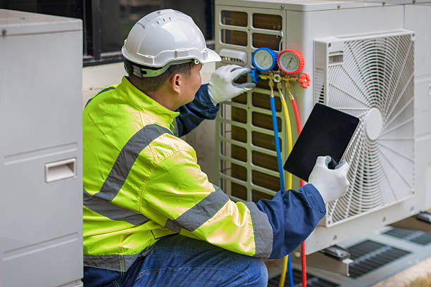 Professional Heat Pump Repair technician working in Westhampton, NY